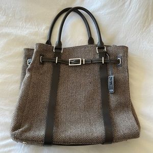 Large brow and white Tumi bag